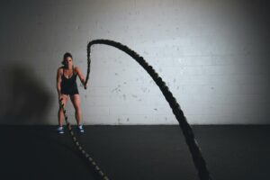 woman-working-out-with-battle-ropes