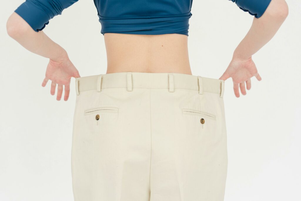 woman-pulling-large-pants-out